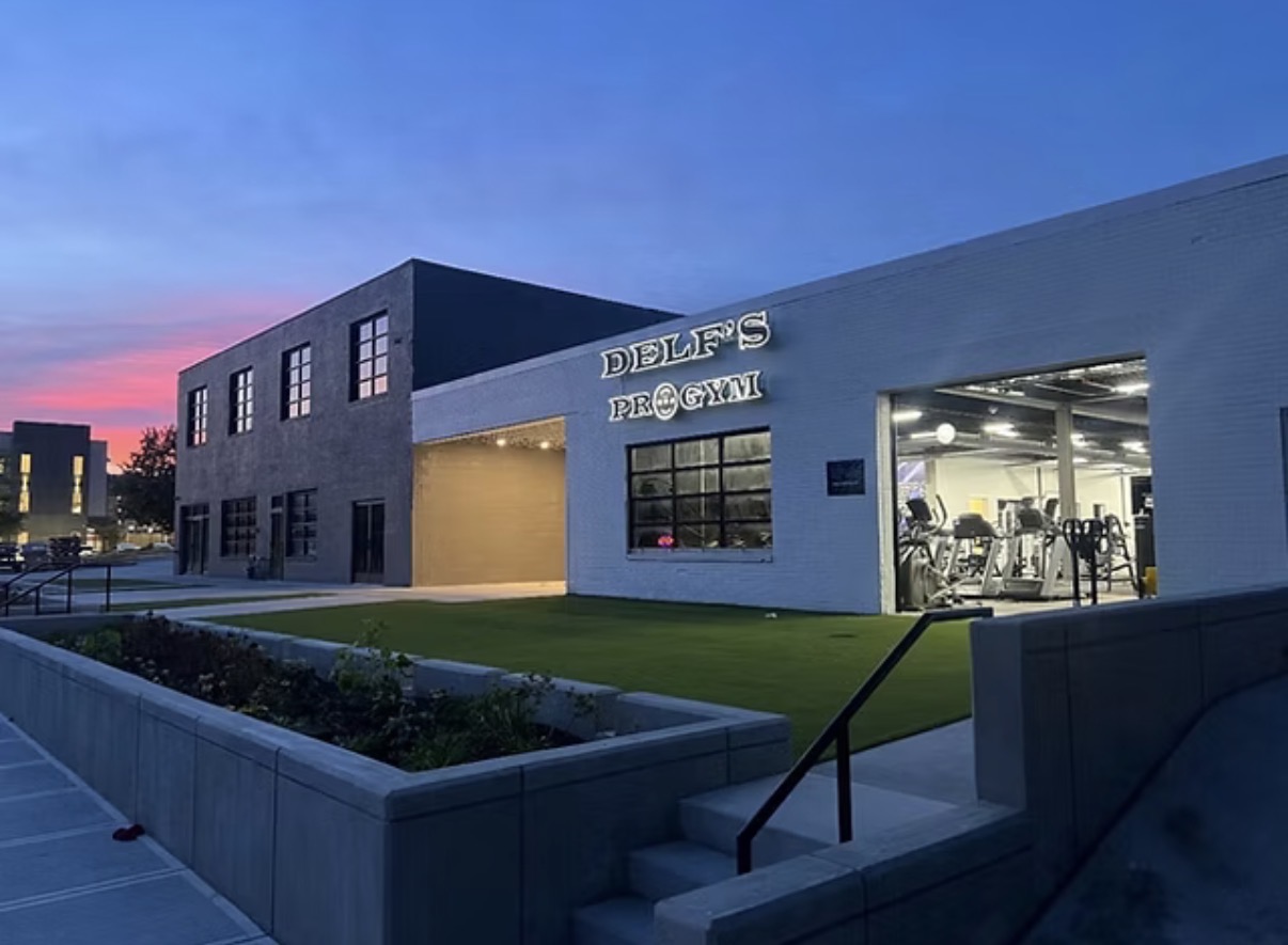 Delf's Pro Gym exterior at dusk in downtown Davenport